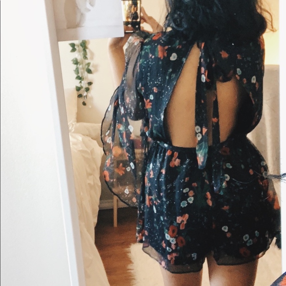 Open-back, flowy, light, floral romper.